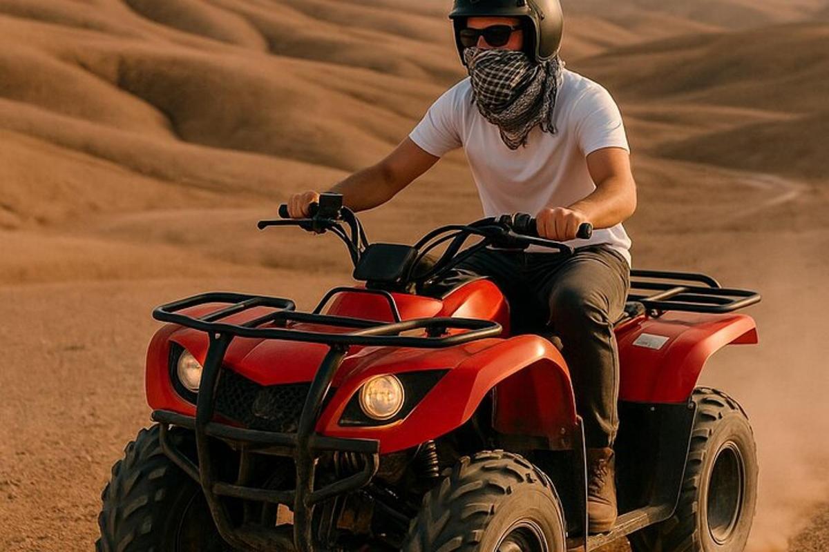 a man riding a quad bike in the desert