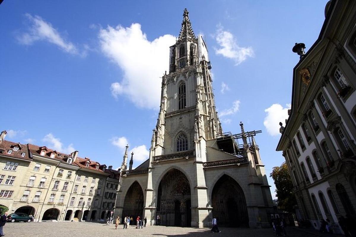 a church with a tall tower in a city