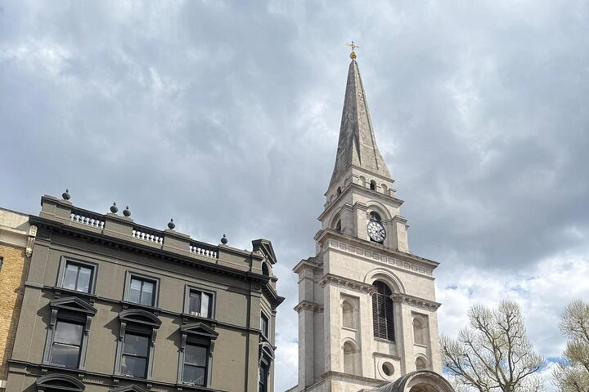 a church steeple with a clock tower next to a building