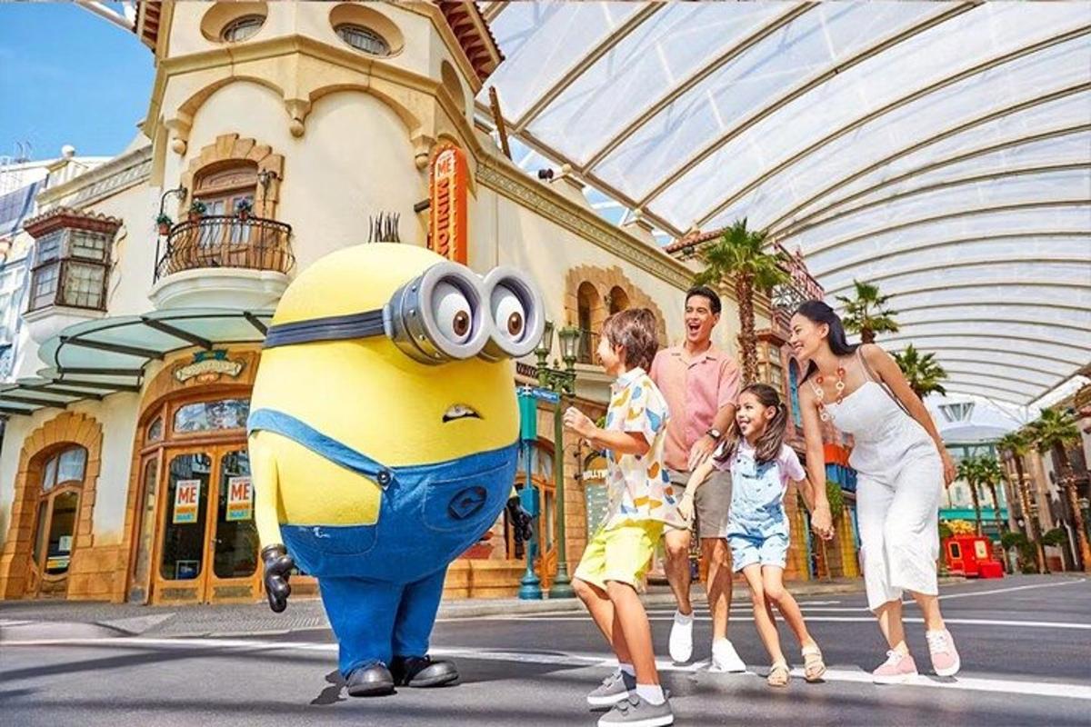 a group of people crossing a street with a minion
