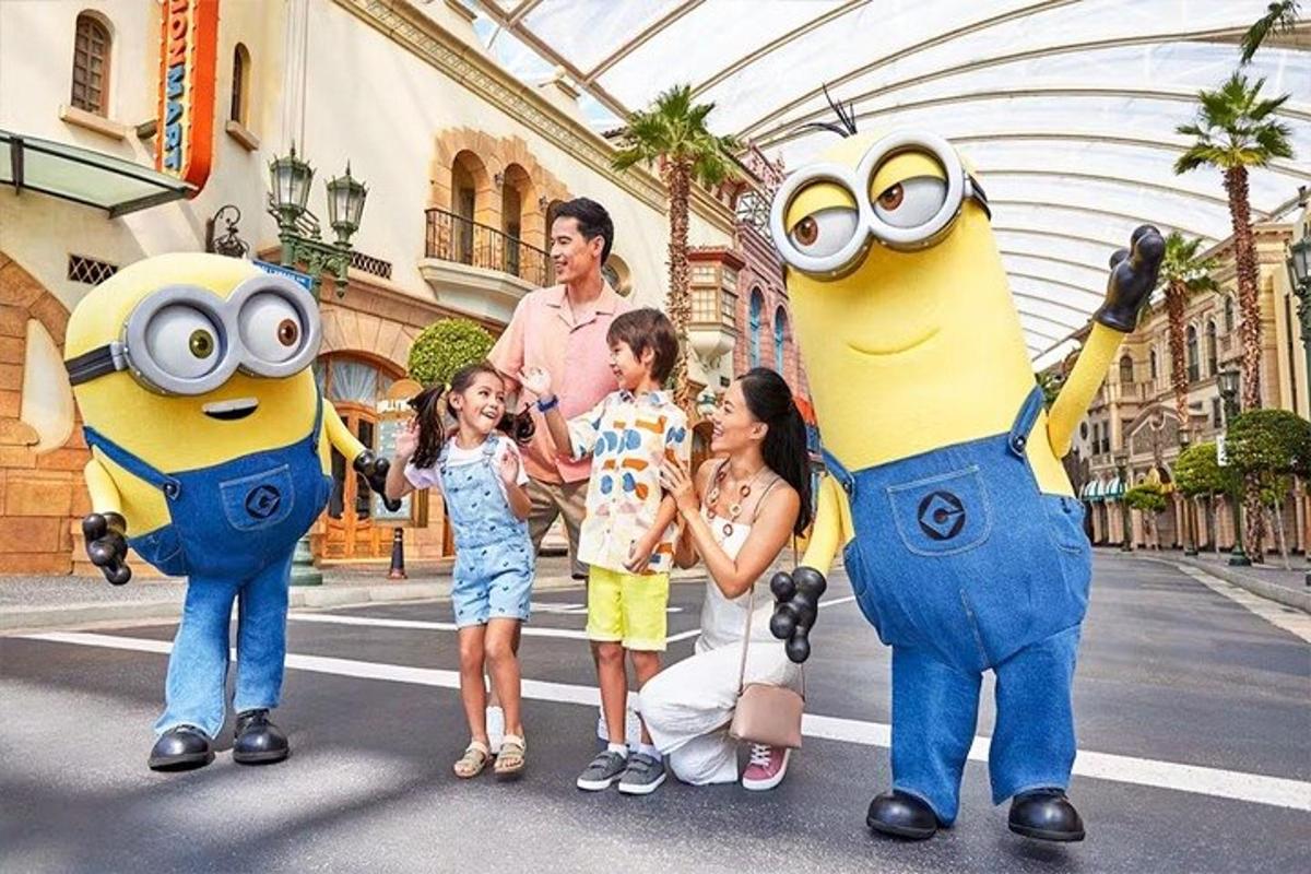 a group of children standing in front of mascots