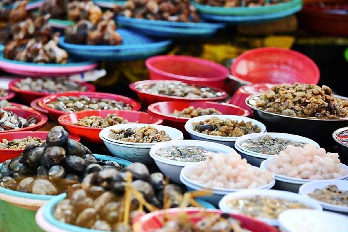a bunch of bowls of food on a table