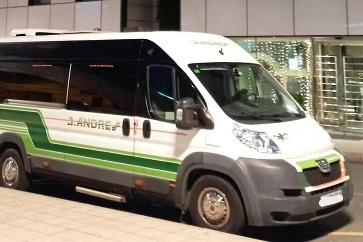 a white and green van parked on a street