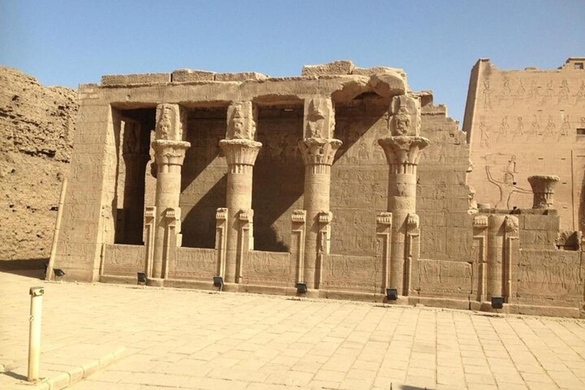 an ancient building with columns in a desert