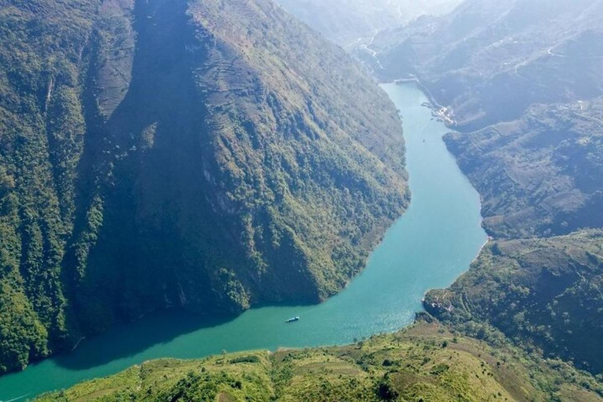 an aerial view of a river between two mountains