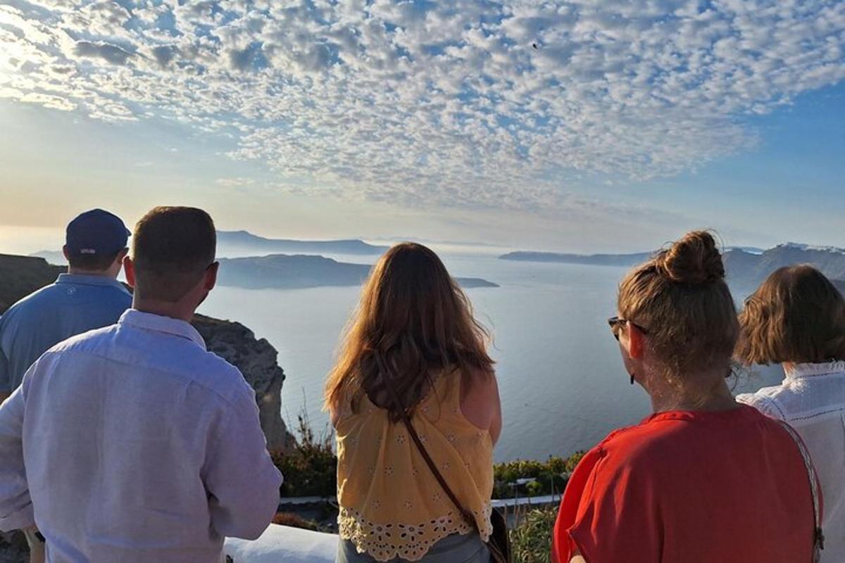 a group of people looking out over the ocean