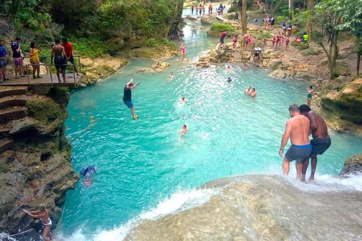 a group of people swimming in a river