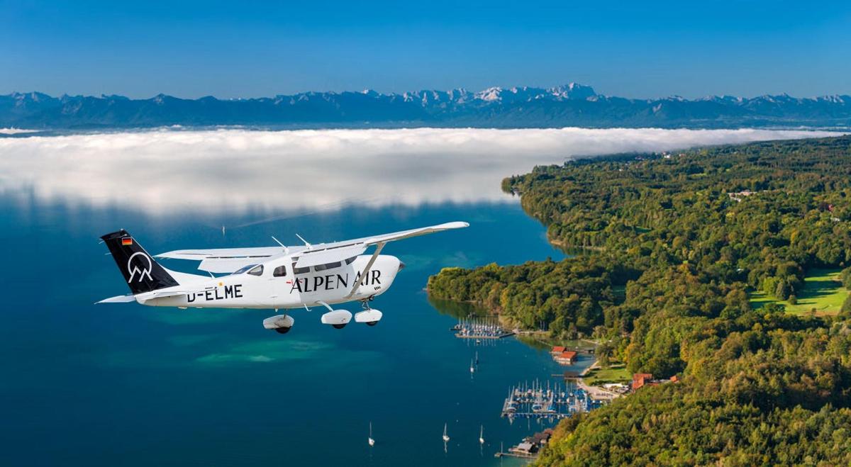 a small plane flying over a body of water