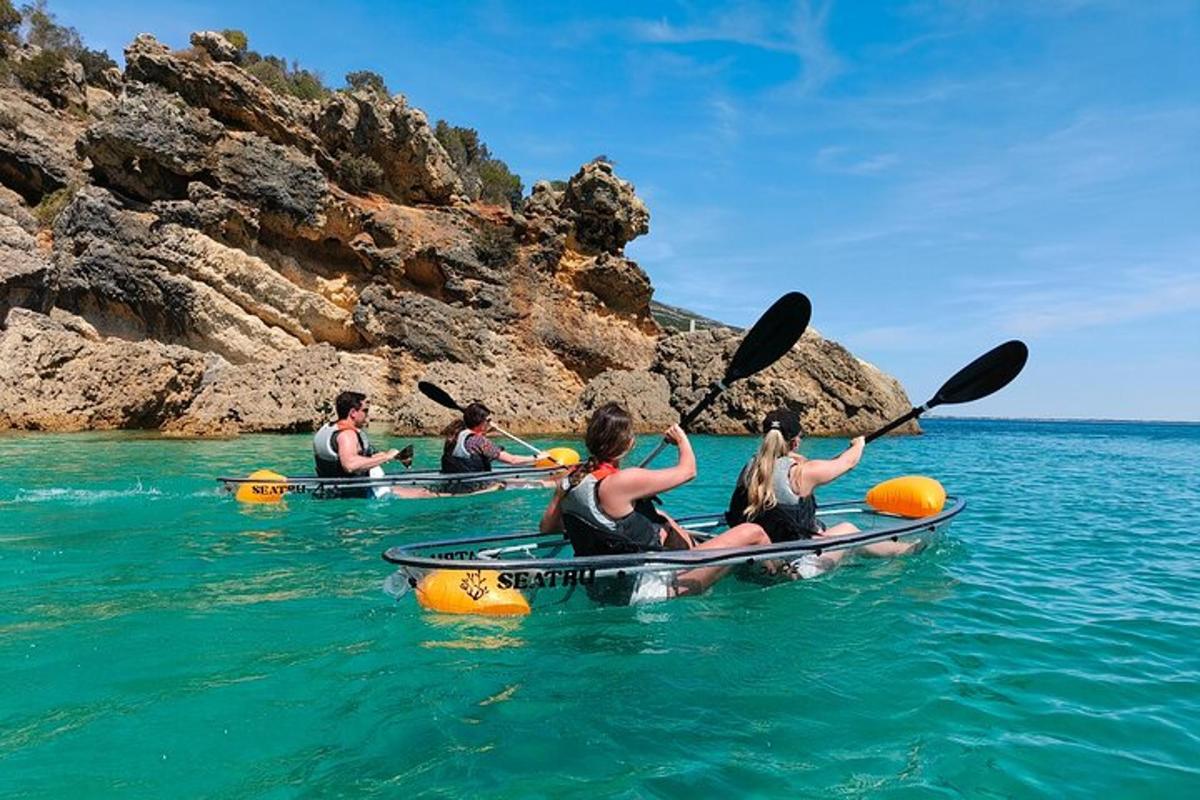 a group of people in kayaks in the water