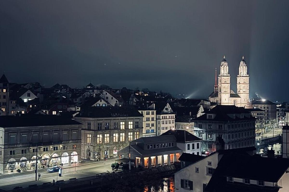 a view of a city at night with a clock tower