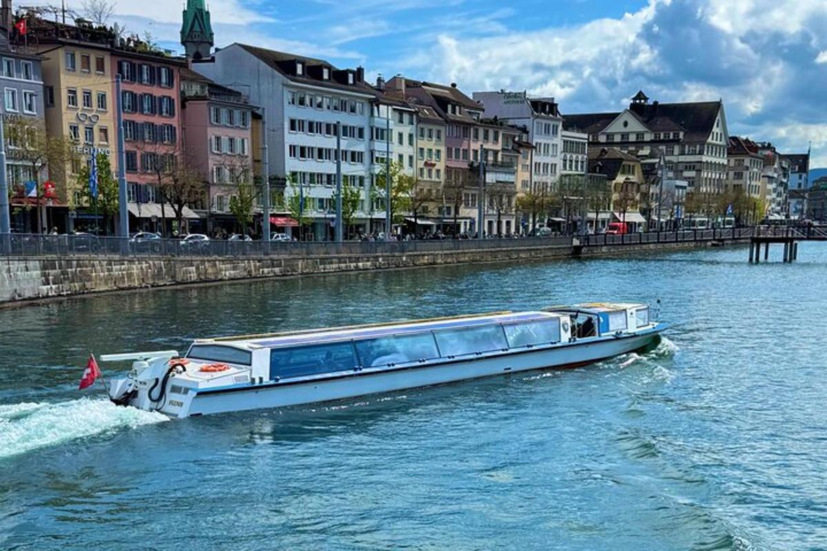 a boat traveling down a river in a city