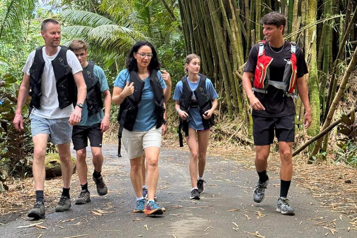 a group of people walking down a trail