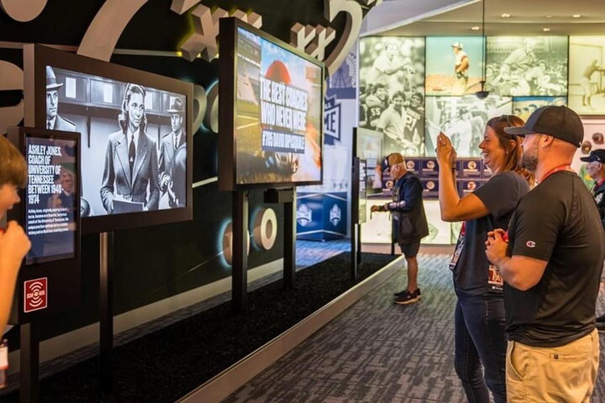 a group of people looking at exhibits in a museum