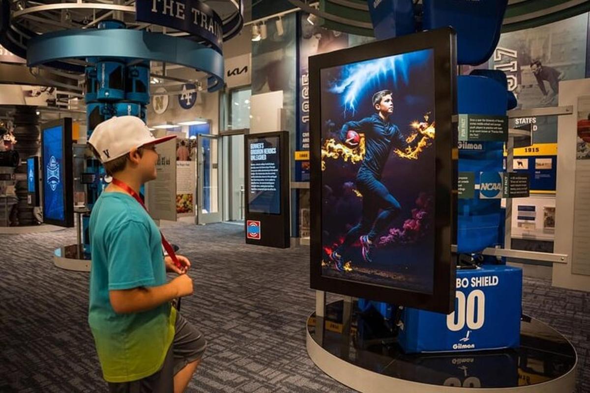 a young boy standing in front of a video game