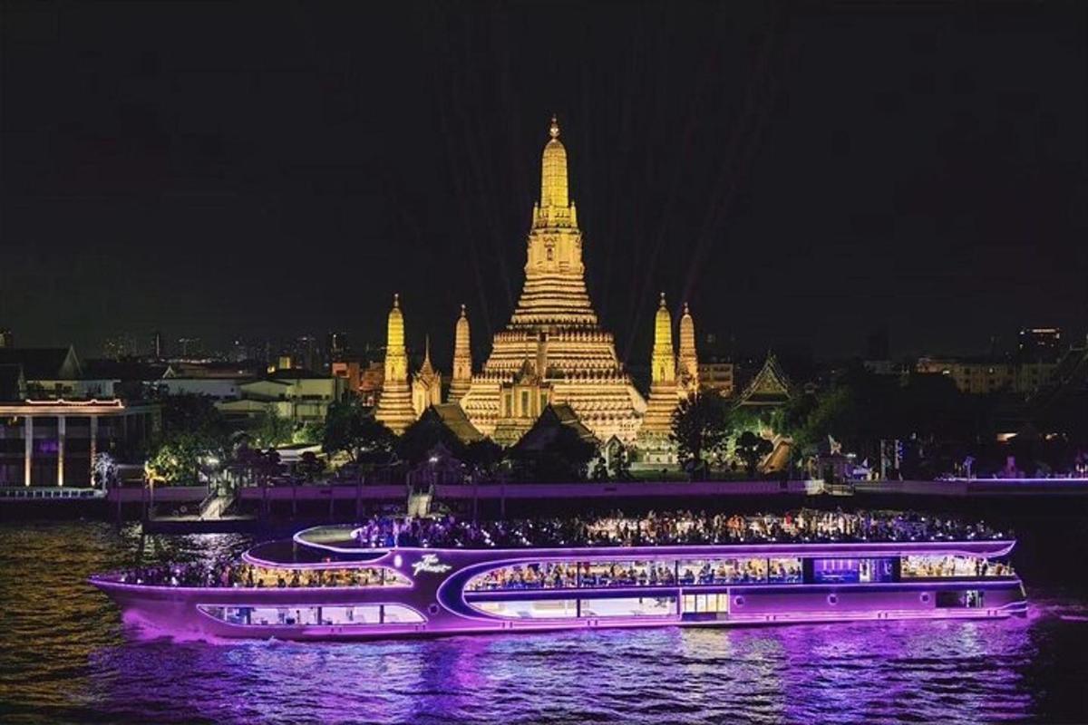 a large building with a crowd of people in front of it at night