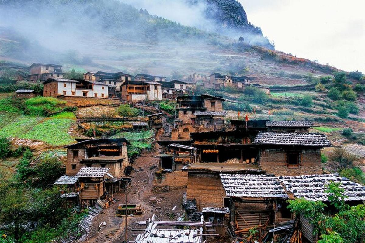 a village on a hill with houses on it