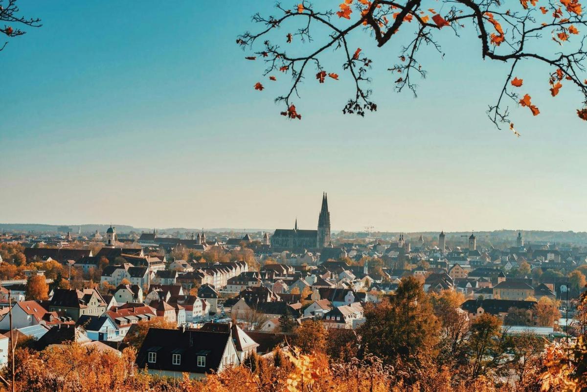 a view of a city with a tower in the background