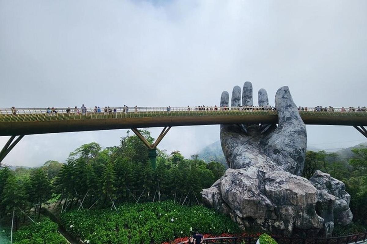 a bridge with a large hand holding up a bridge