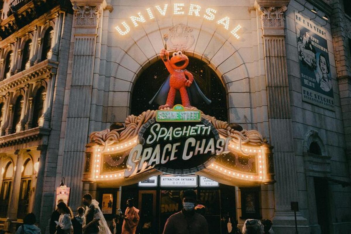 a sign in front of a large building with people