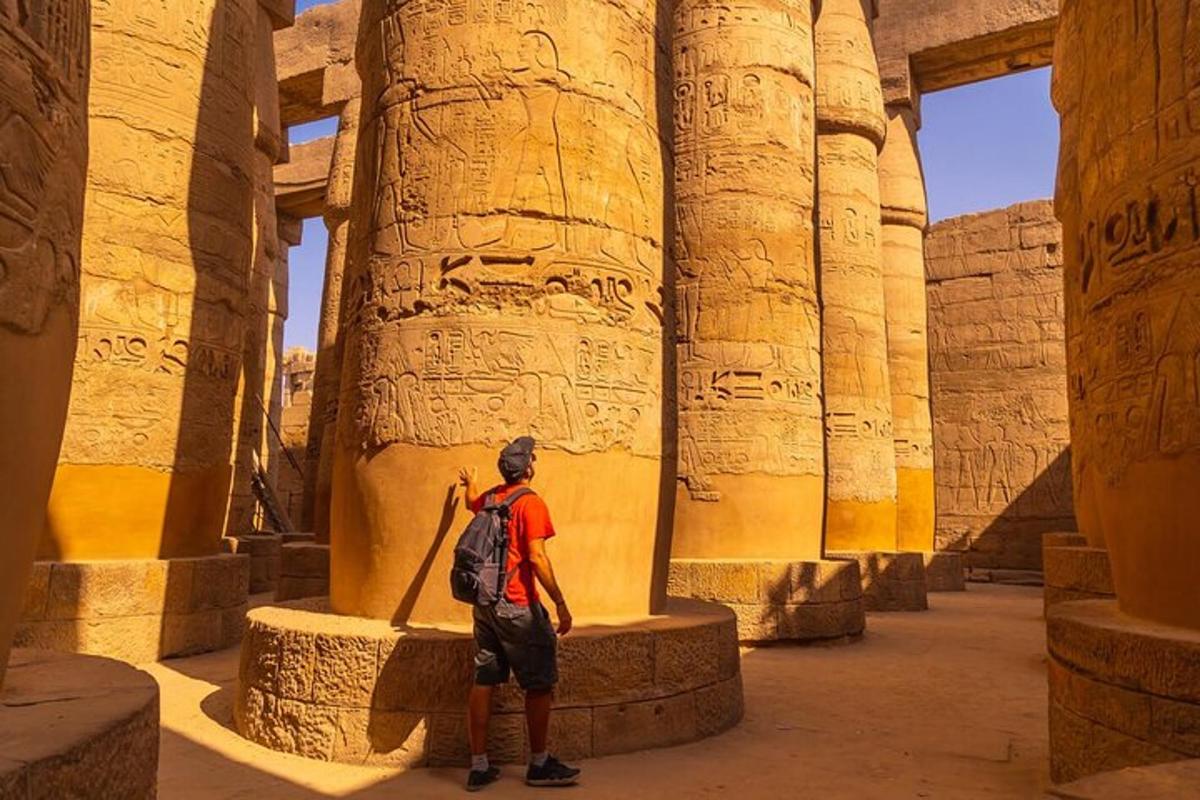 a man standing in a temple with columns