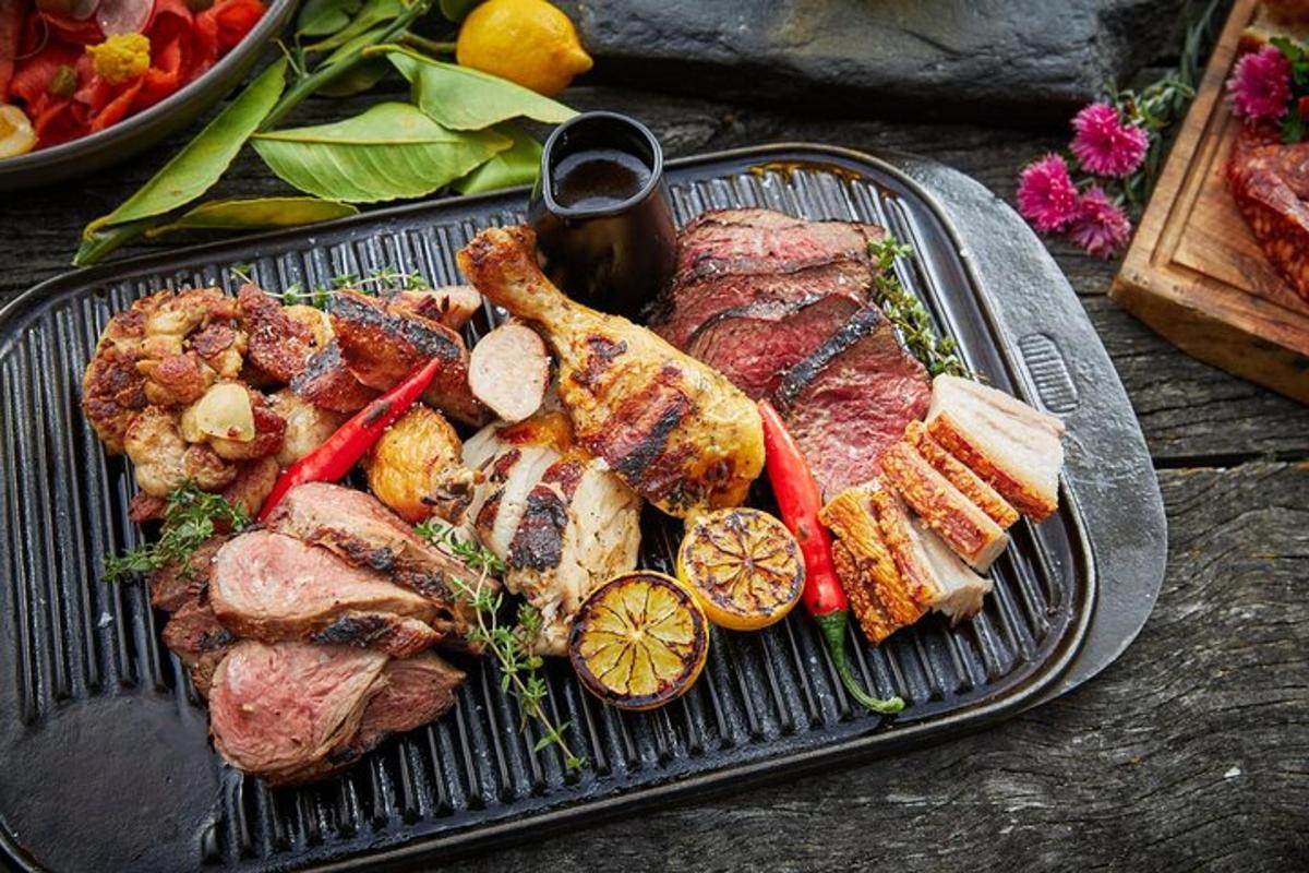 a grill with meat and vegetables on a table