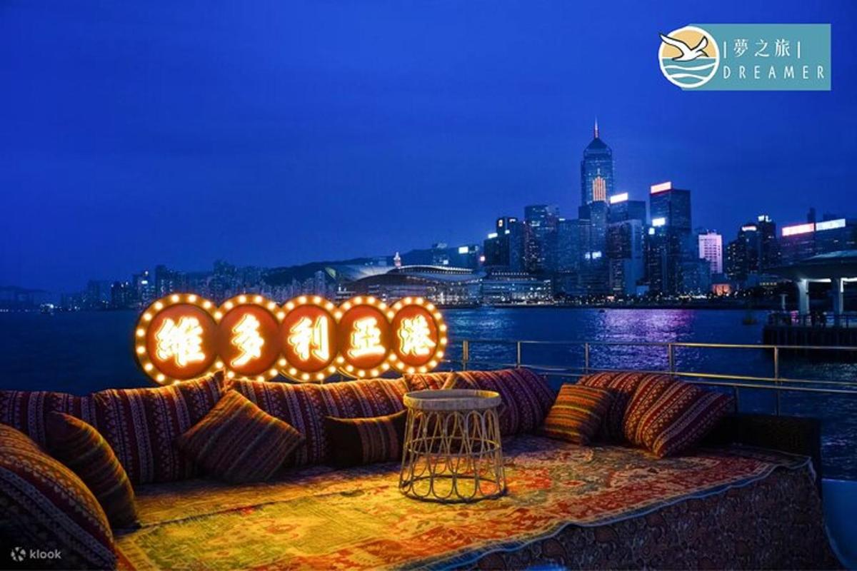 a couch sitting on top of a balcony with a city skyline
