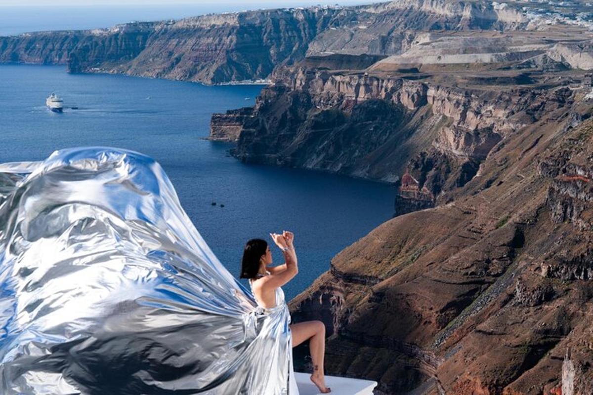 a woman sitting on the edge of a cliff overlooking the canyon