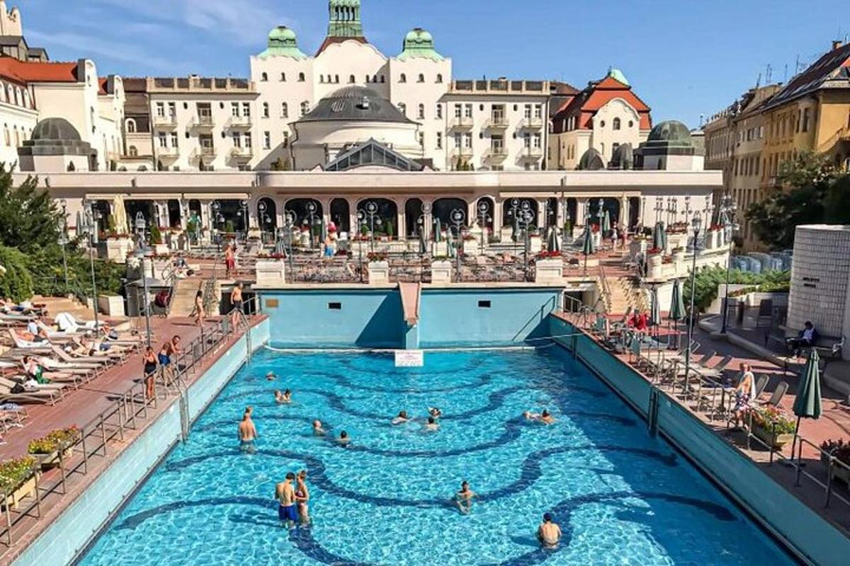 a group of people in a swimming pool at a hotel