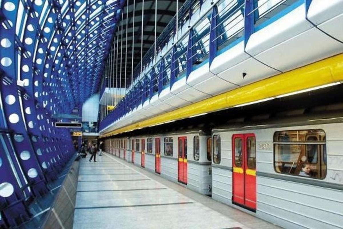 a subway station with a subway train in it