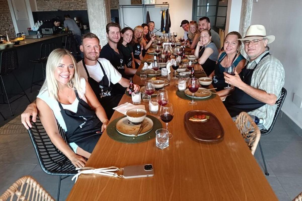 a group of people sitting around a long table