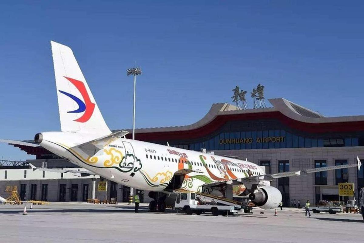 an airplane is parked on the runway at an airport