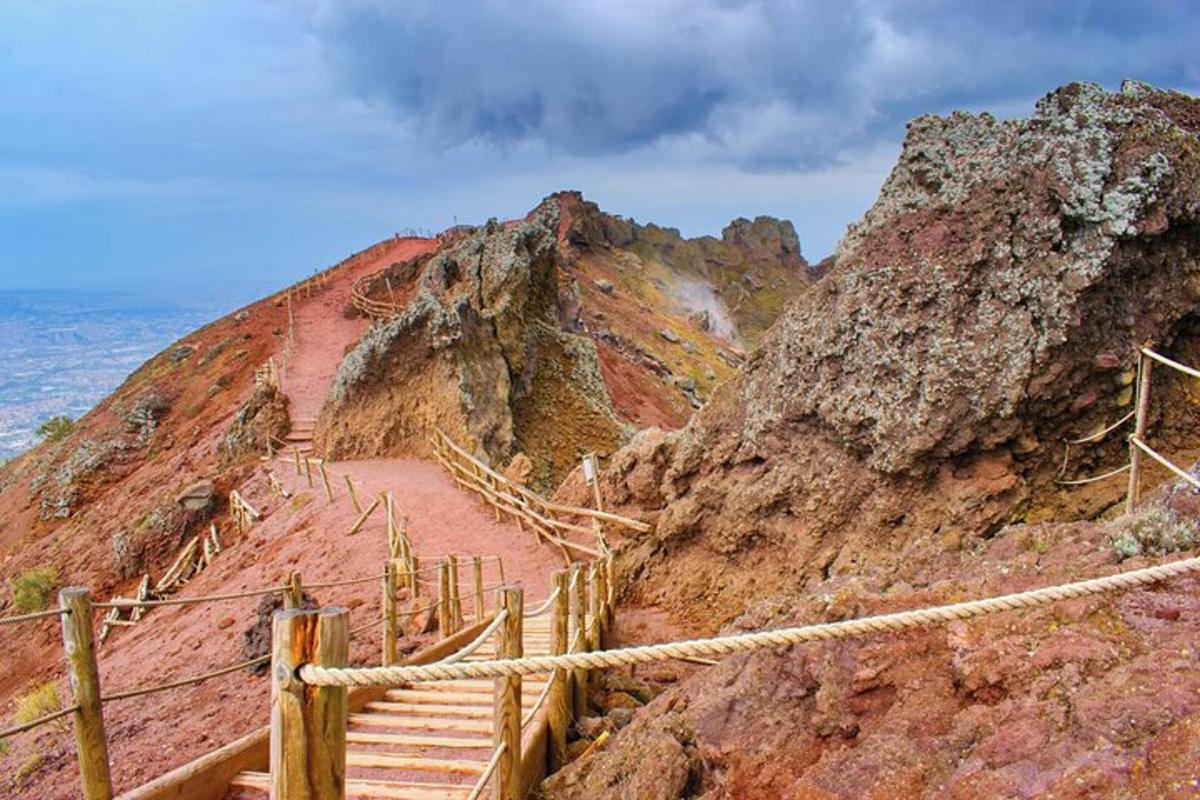 a staircase on a mountain next to the ocean
