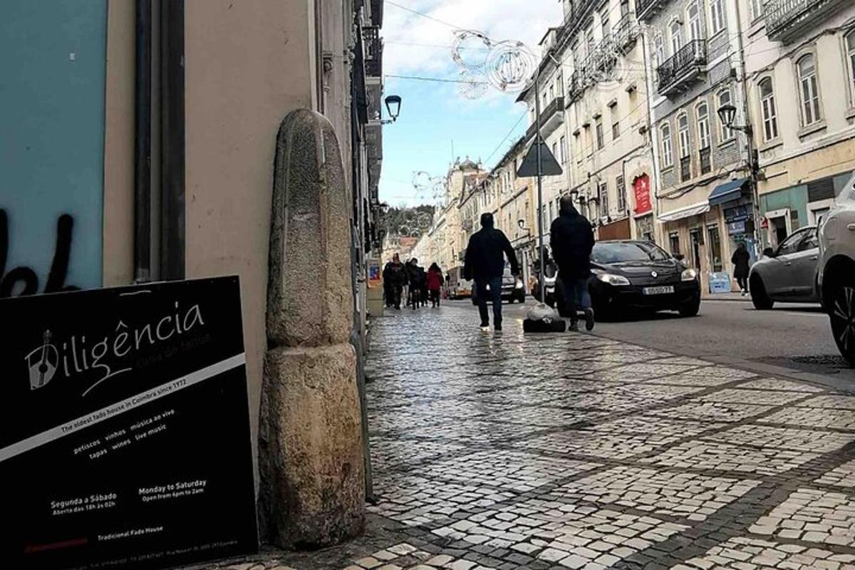 a street with people walking down the street