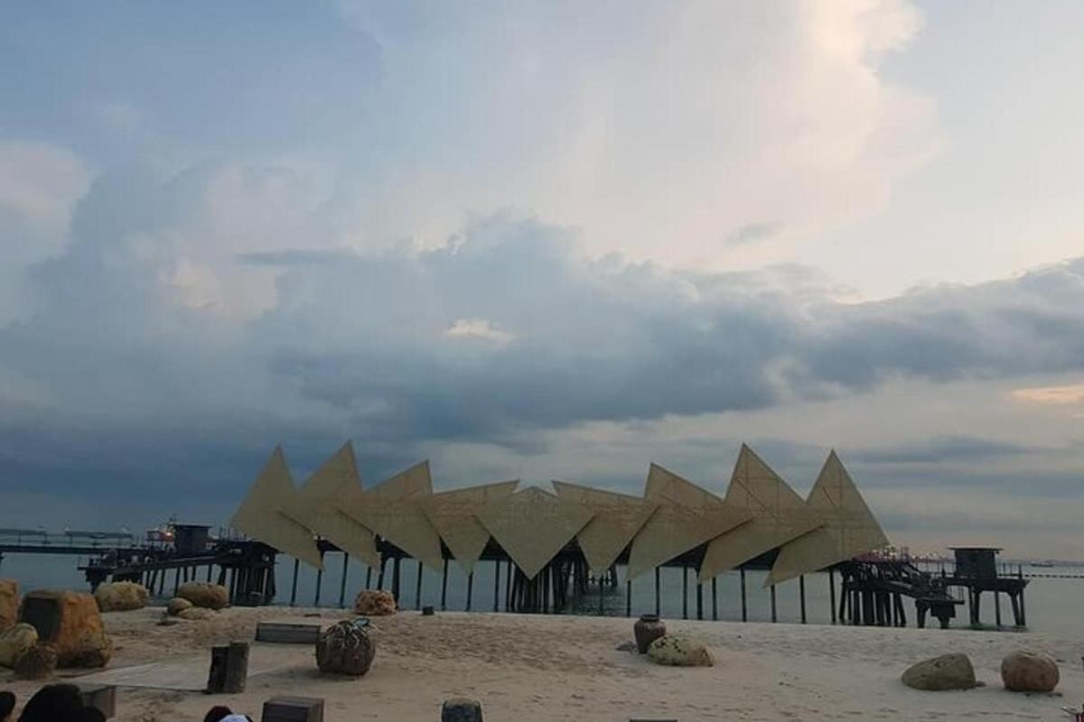 a group of wooden buildings on a beach