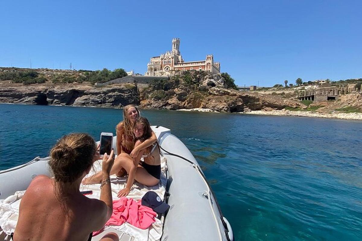 a group of people on a boat in the water