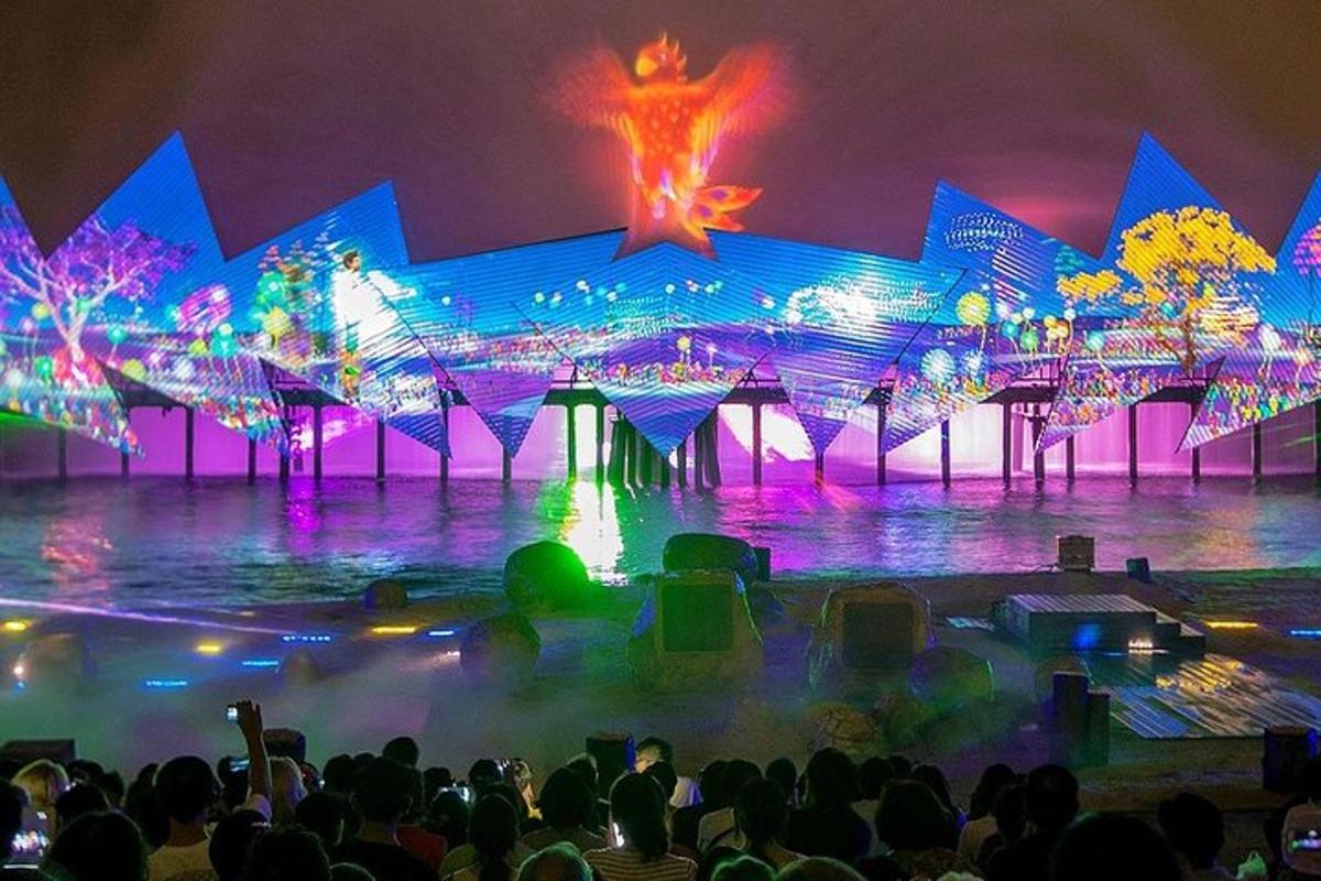 a crowd of people watching a stage with lights
