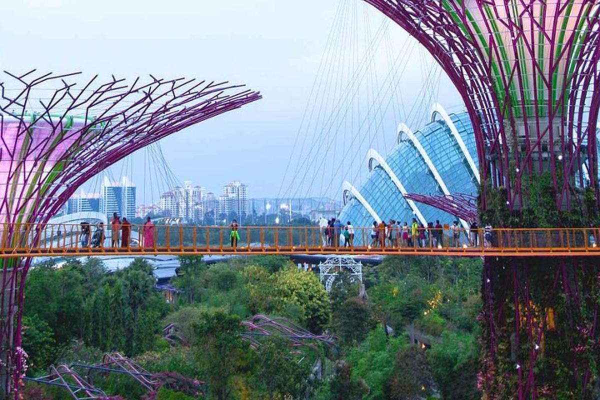 a group of people on a bridge in a city