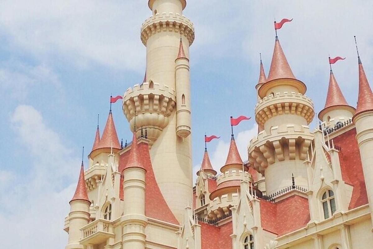 a castle building with red and white turrets