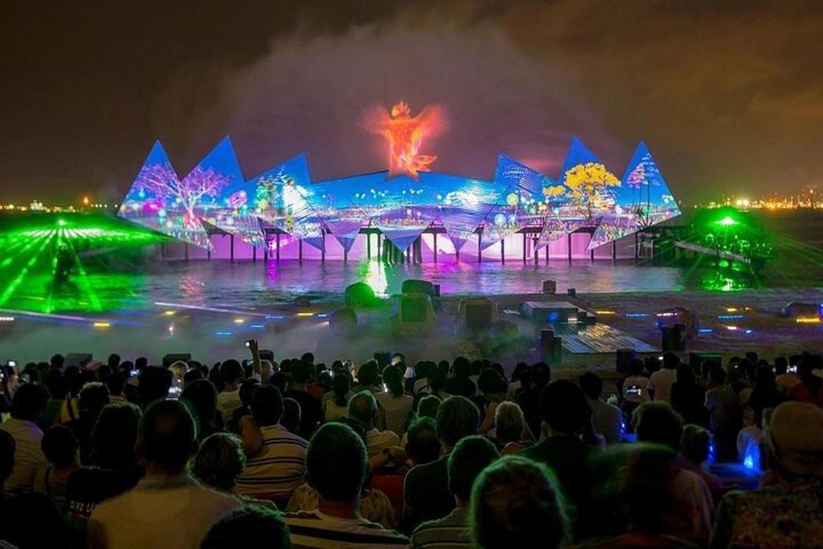 a crowd of people watching a performance at a concert