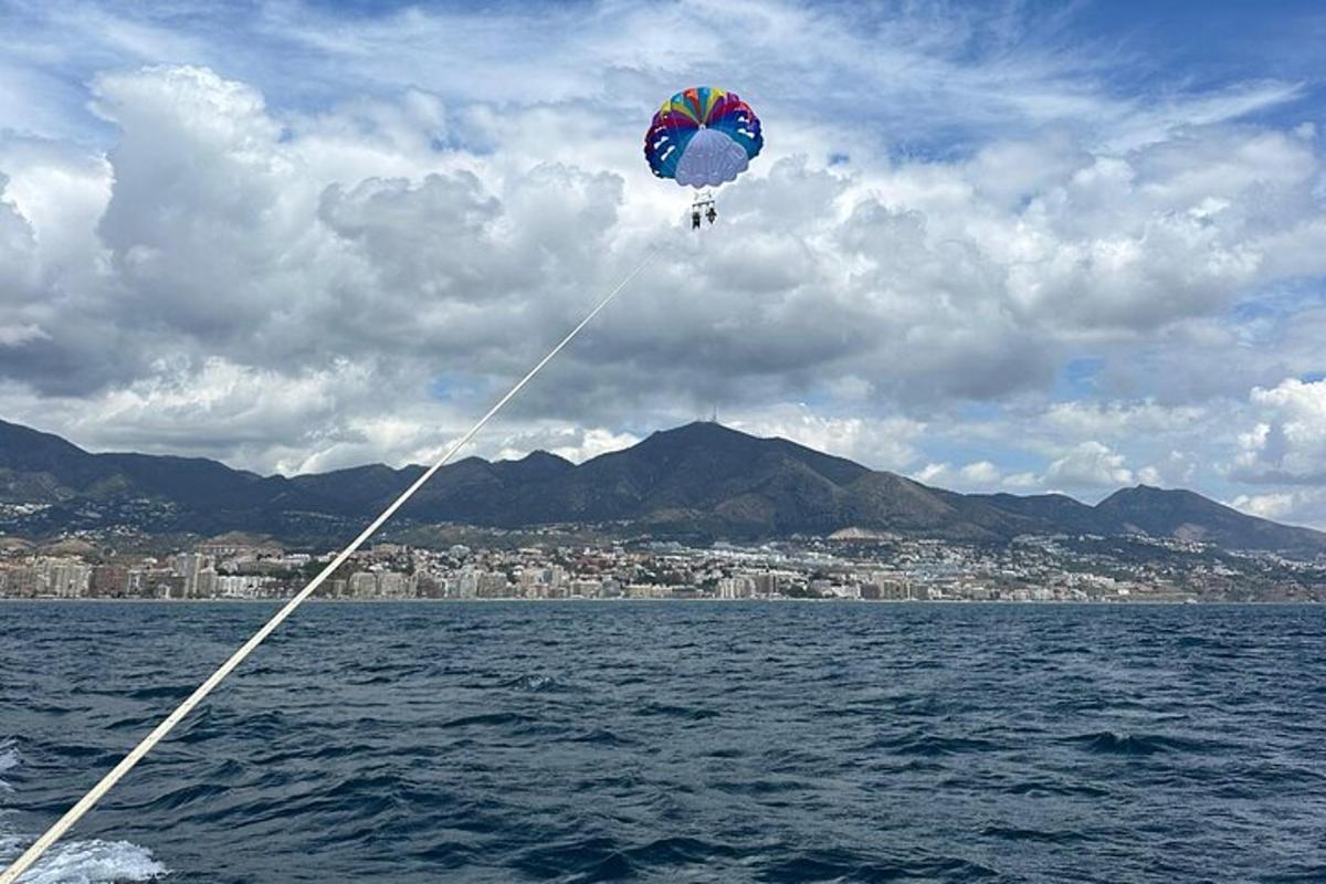 a kite flying in the sky over the water