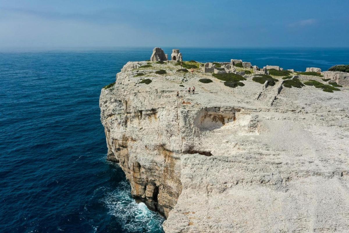 an overlook of a cliff in the ocean