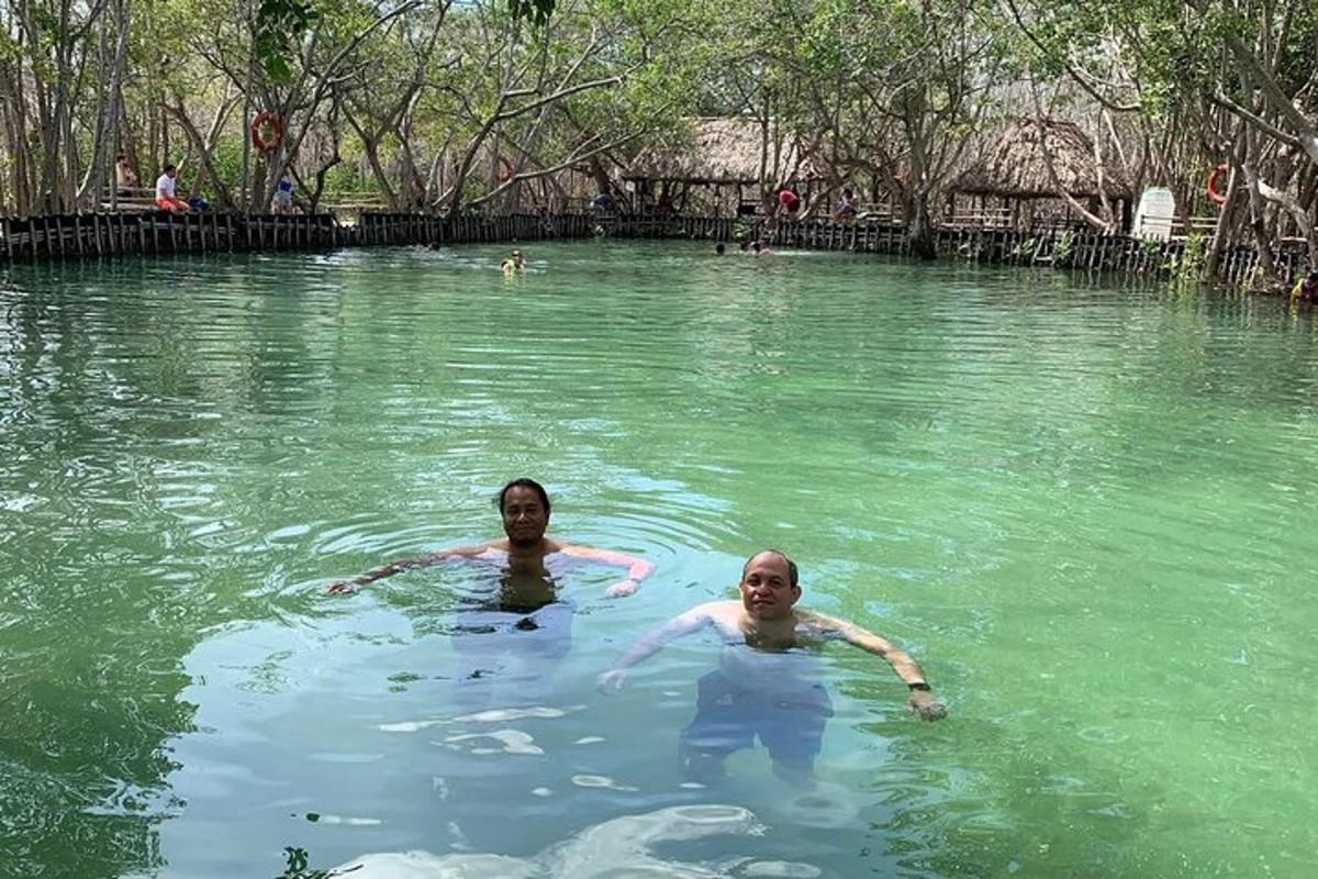 two people swimming in a body of water