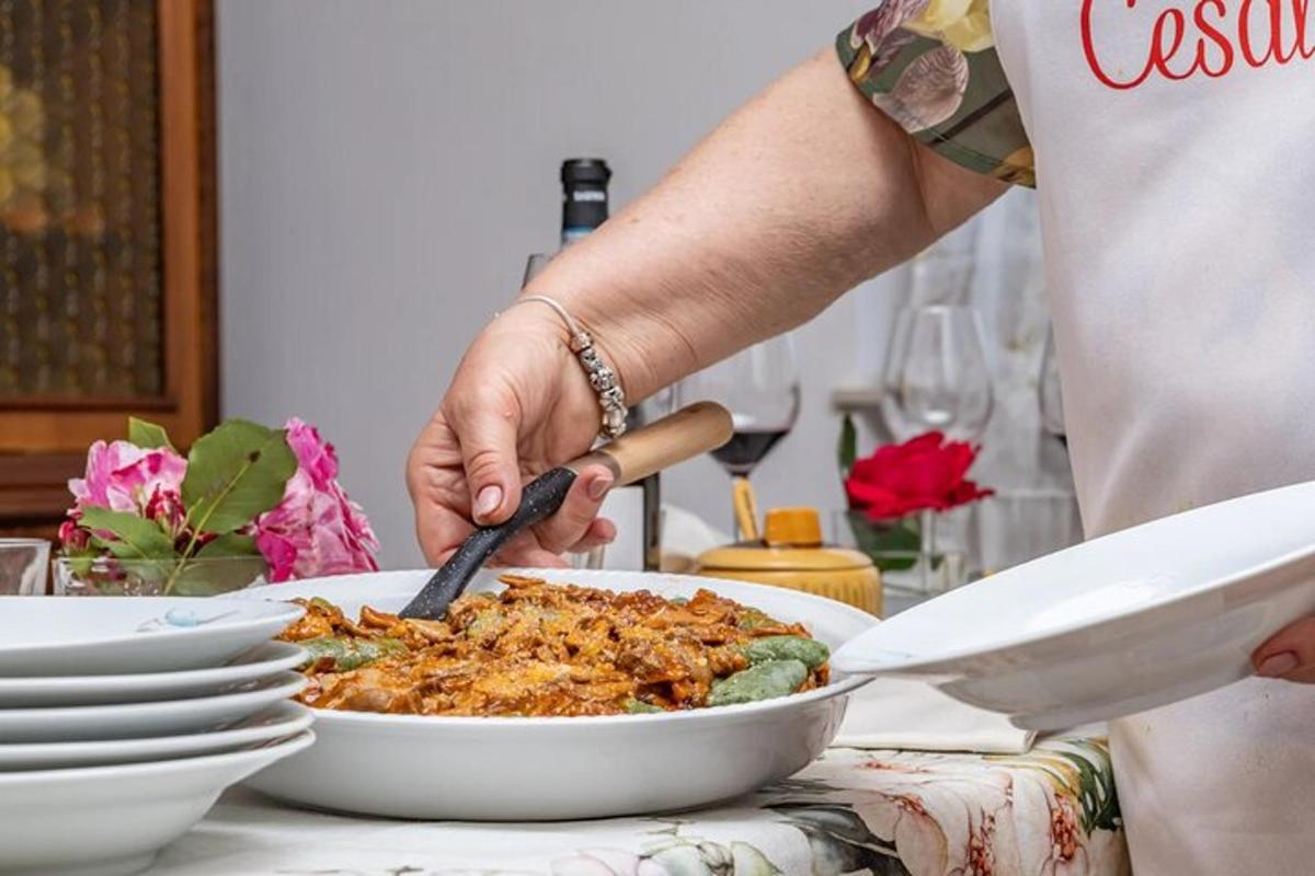 a person is preparing a dish of food on a table