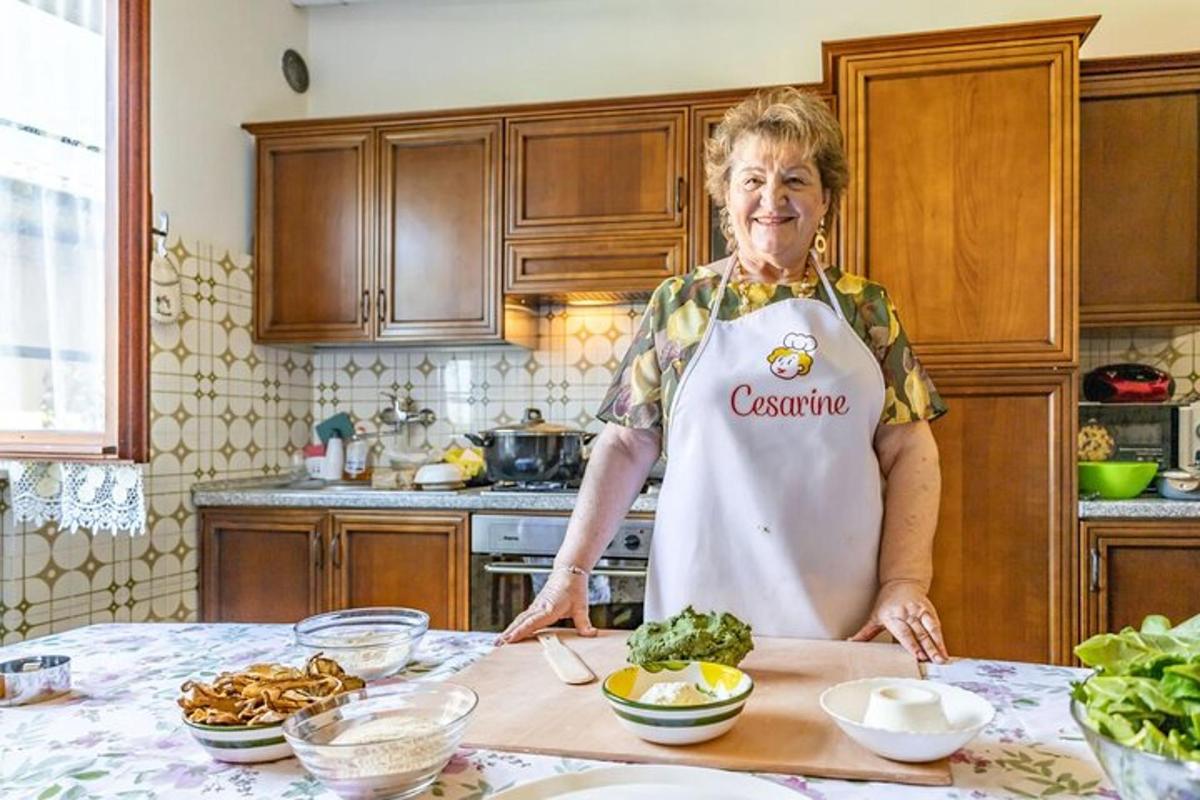 a man standing in a kitchen preparing food