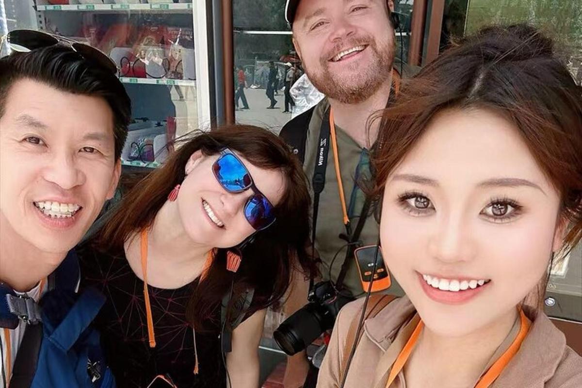 a group of three people posing for a picture