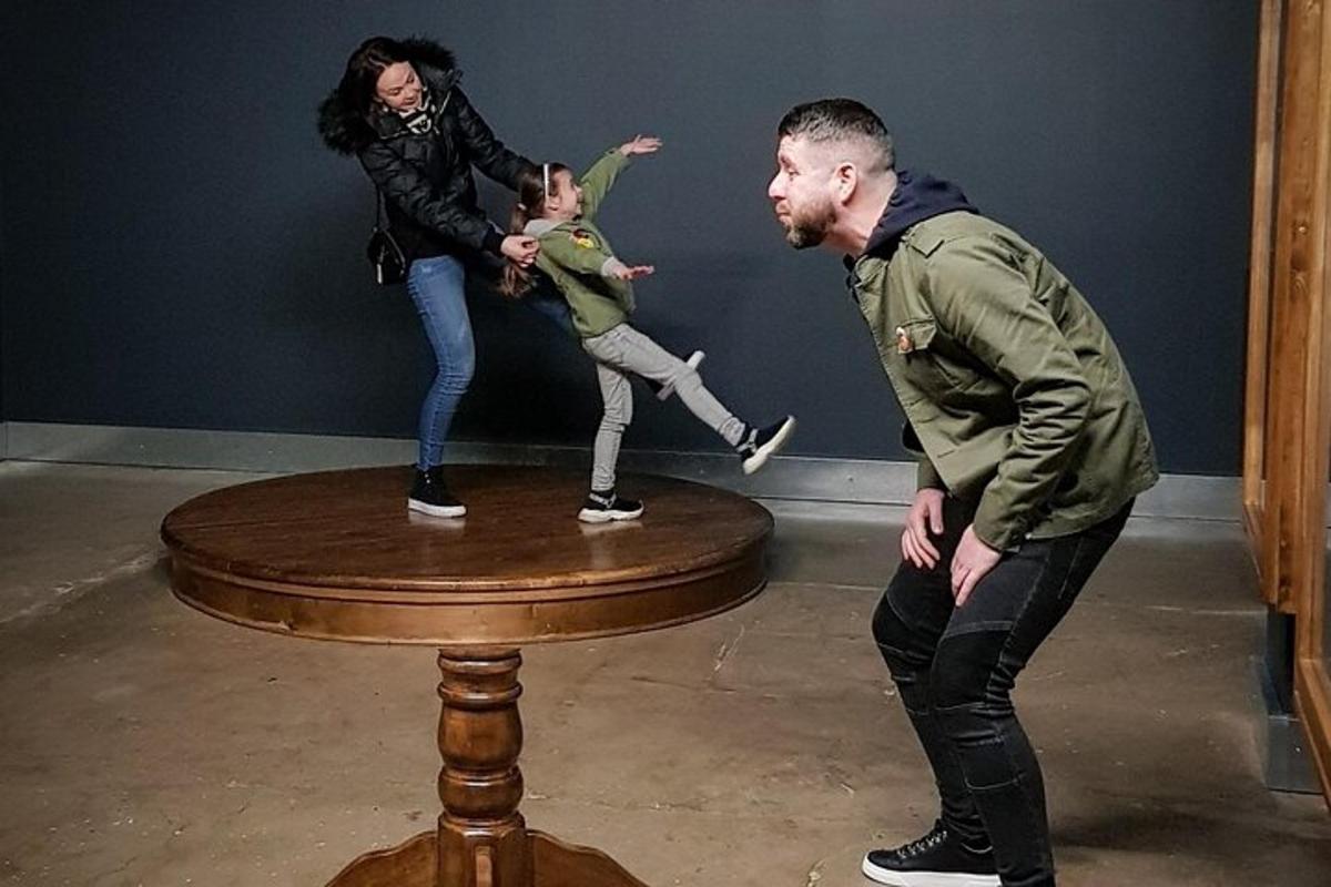 a man and a woman standing on top of a table