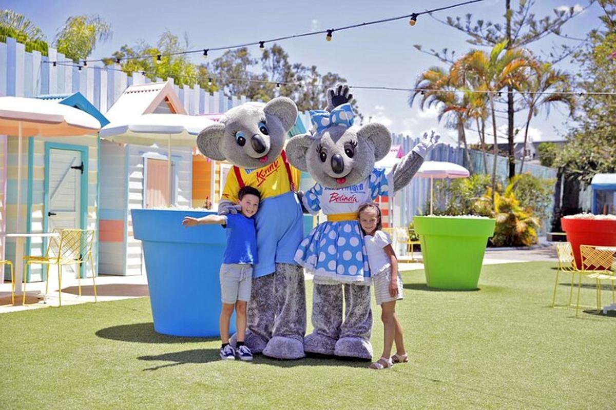 two children are standing in front of two stuffed animals