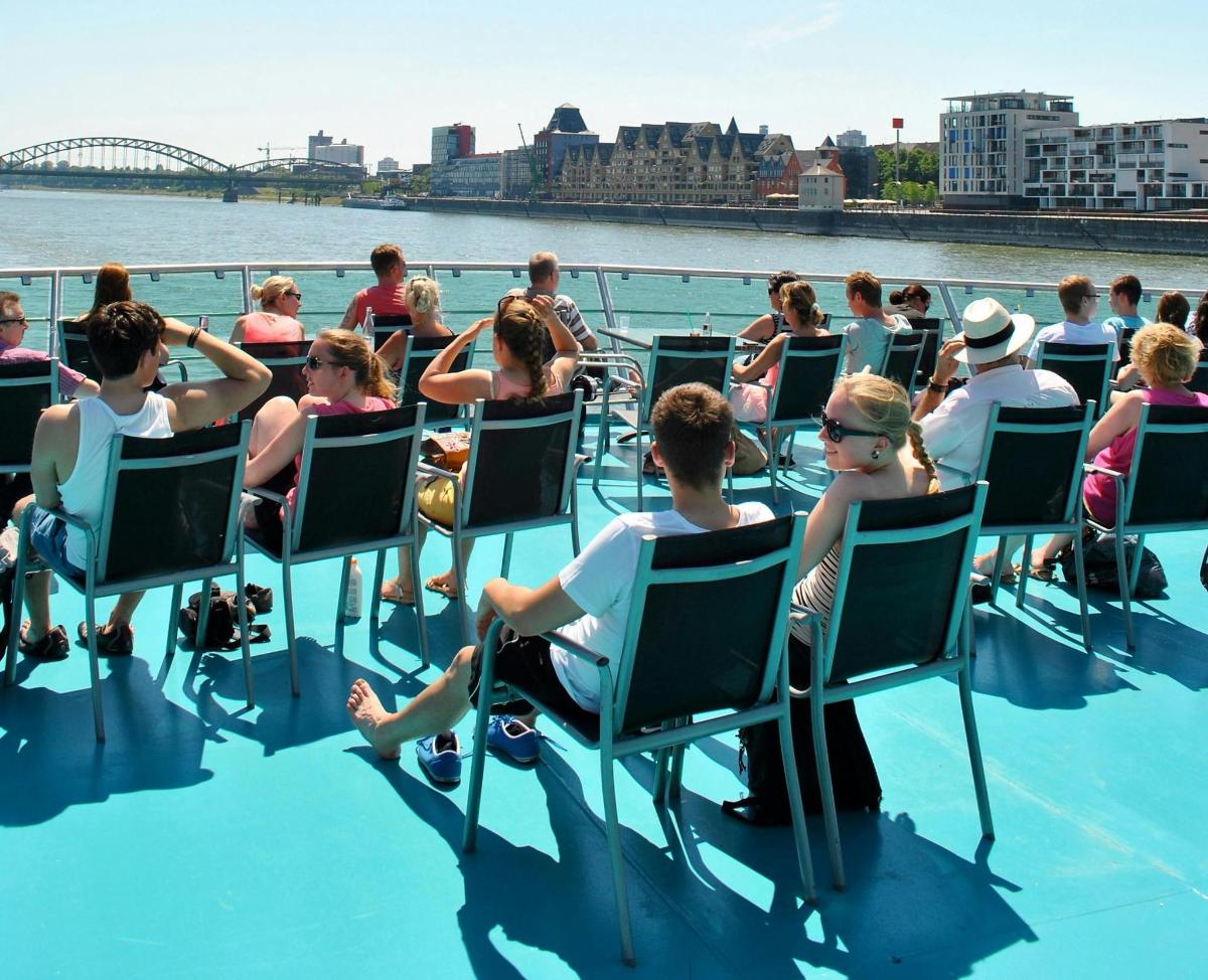 a group of people sitting in chairs on a boat