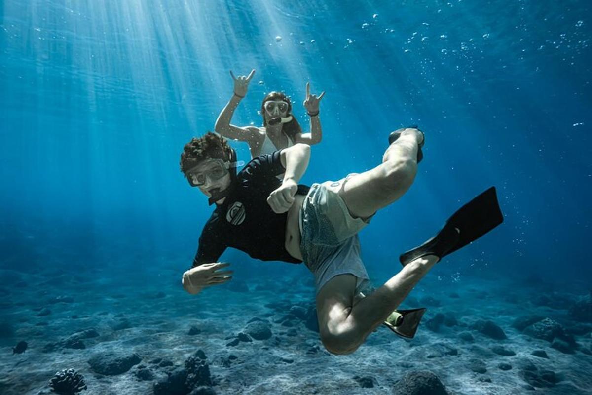 a man and a woman swimming in the water