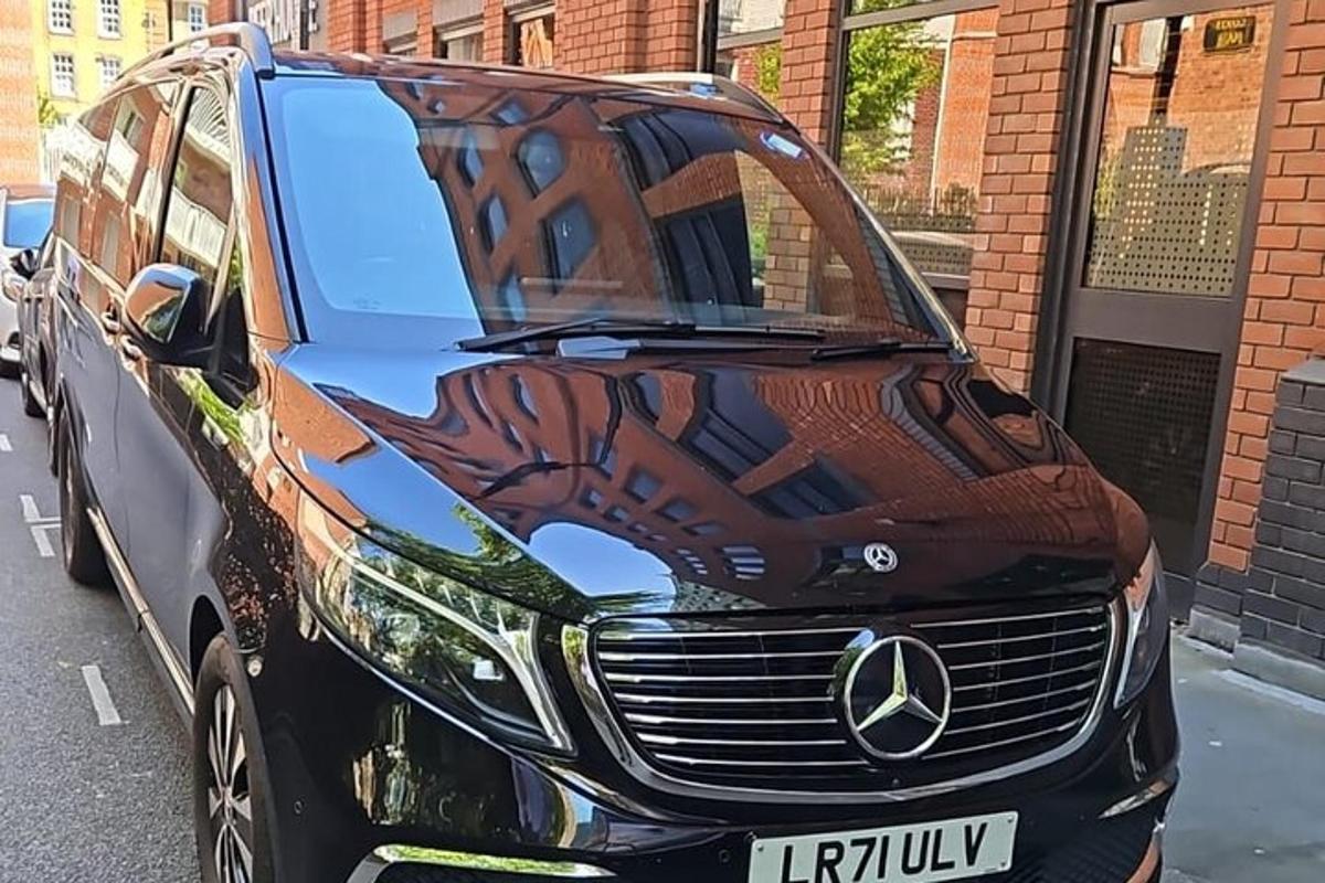 a mercedes benz car parked on a street